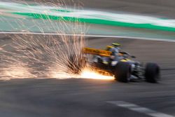 Sparks fly from the car of Carlos Sainz Jr., Renault Sport F1 Team R.S. 18