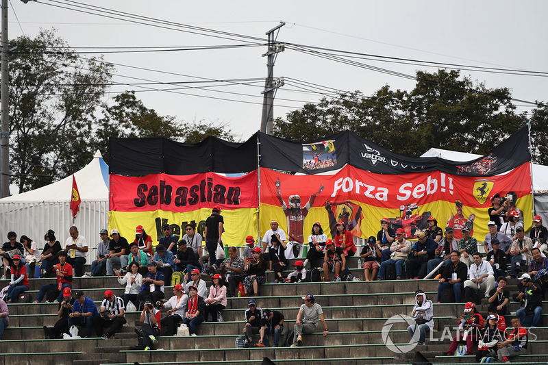 Sebastian Vettel, Ferrari fans and banners