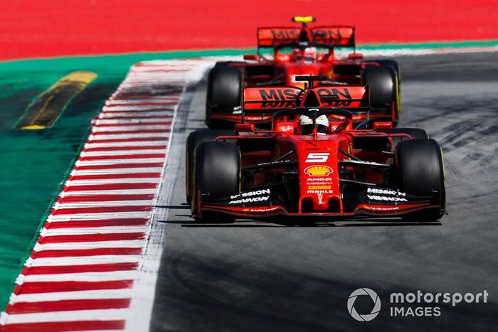 Sebastian Vettel, Ferrari SF90, leads Charles Leclerc, Ferrari SF90