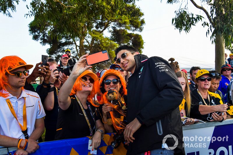 Esteban Ocon, Mercedes AMG F1 poses for a selfie with a fan.
