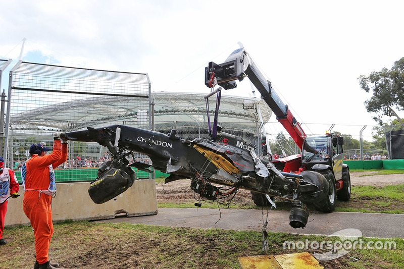 The McLaren MP4-31 of Fernando Alonso, McLaren is removed from the gravel trap after his race stoppi