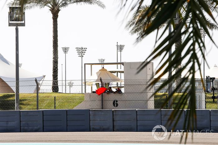 Marshals wave the red flag