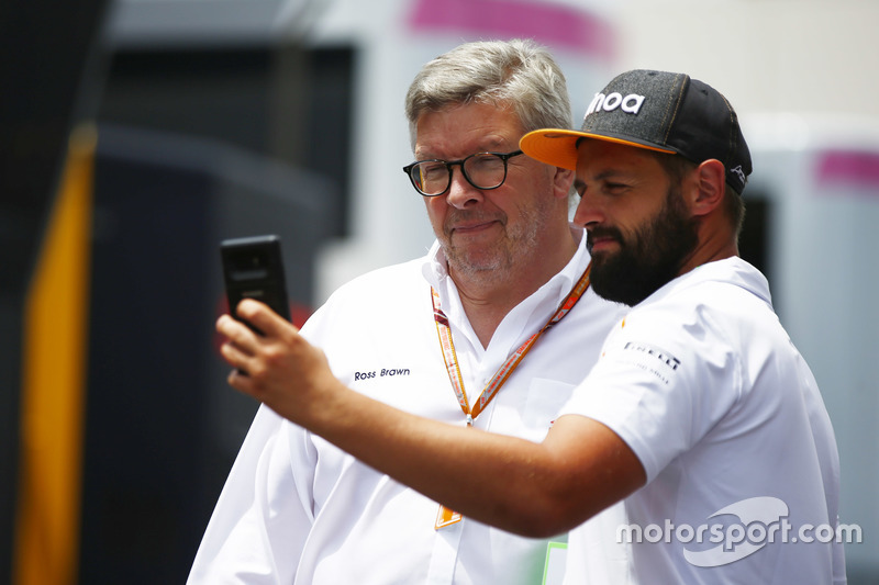 Ross Brawn, Managing Director of Motorsports, FOM, poses for a selfie with a fan