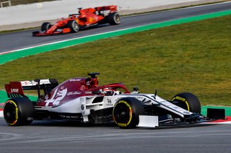 Kimi Raikkonen, Alfa Romeo Racing C38, leads Sebastian Vettel, Ferrari SF90