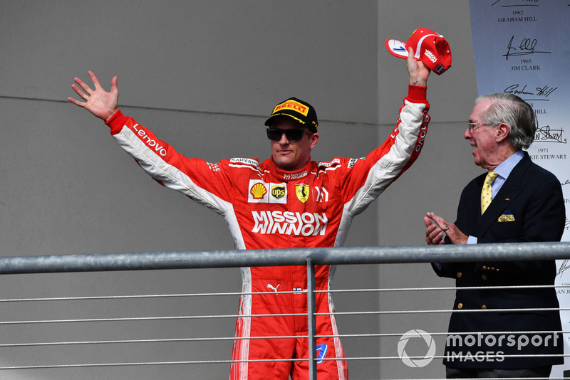 Race winner Kimi Raikkonen, Ferrari celebrates on the podium