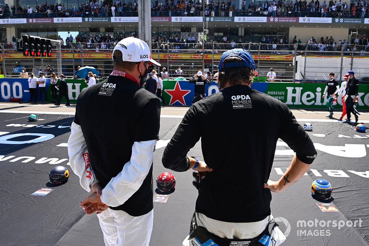 Kimi Raikkonen, Alfa Romeo Racing, and Fernando Alonso, Alpine F1

