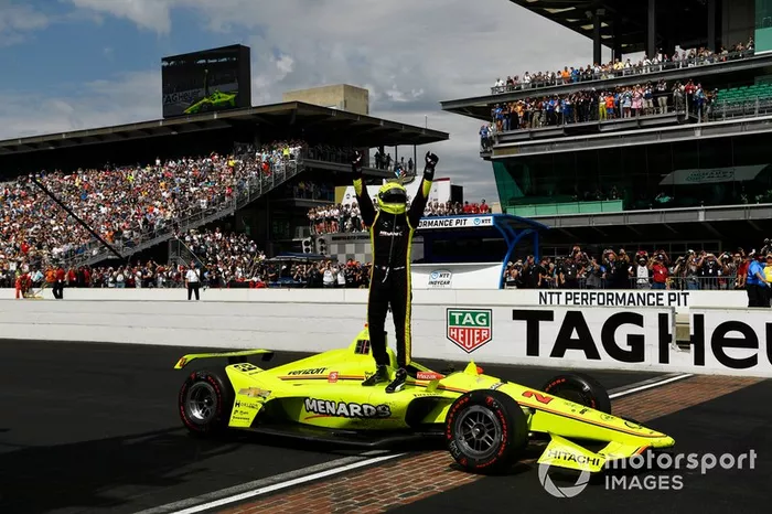 Simon Pagenaud, Team Penske Chevrolet celebrates the win on the track over the yard of bricks