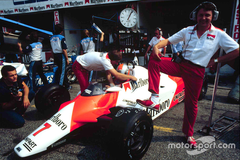 McLaren chief designer John Barnard stands by a McLaren MP4/1B Ford