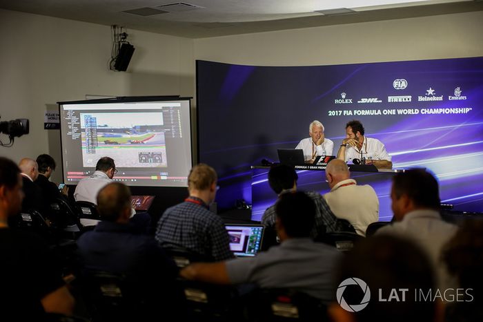 Charlie Whiting, FIA Delegate and Matteo Bonciani, FIA Media Delegate in the Press Conference discussing the Kimi Raikkonen, Ferrari and Max Verstappen, Red Bull Racing incident at United States Grand Prix
