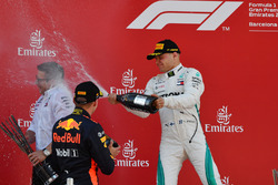 Max Verstappen, Red Bull Racing and Valtteri Bottas, Mercedes-AMG F1 celebrate on the podium with the champagne