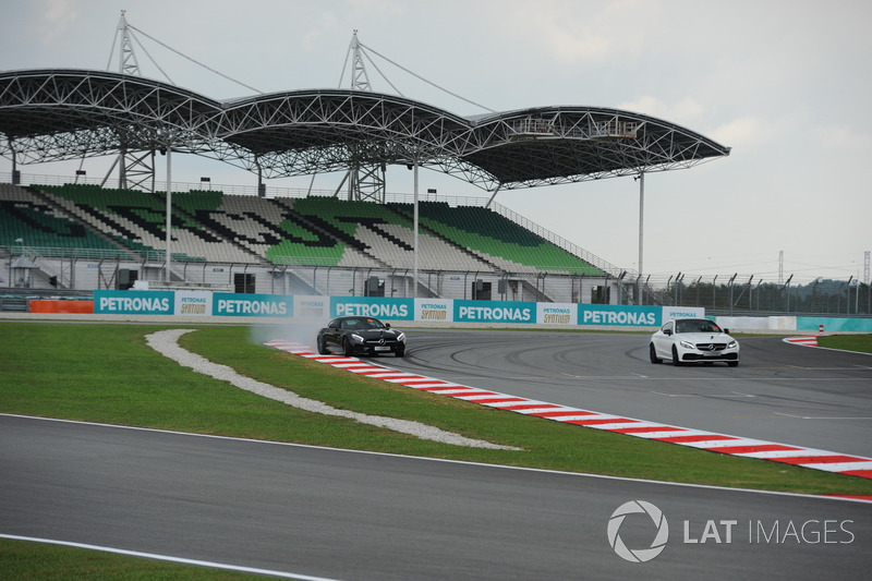 Lewis Hamilton, Mercedes AMG F1 in a Mercedes AMG GTS