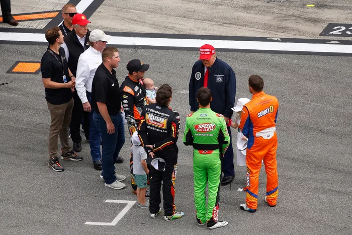 U.S. President Donald Trump greets the Nascar Cup drivers