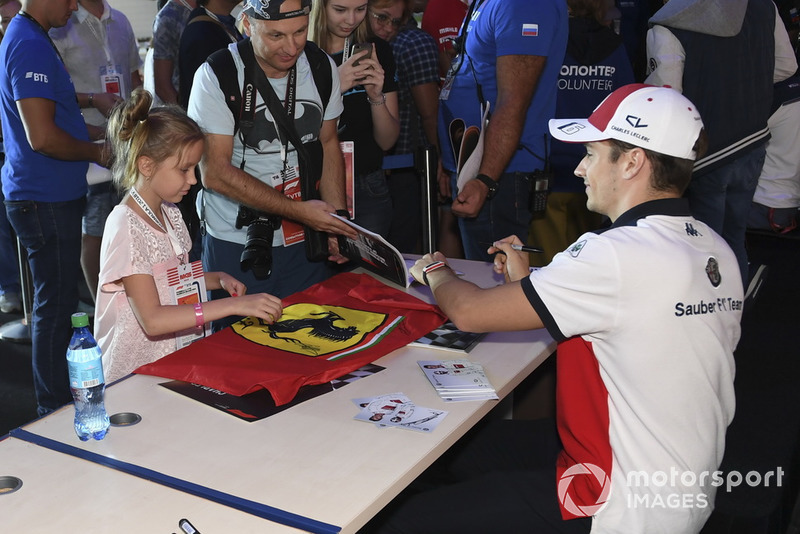 Charles Leclerc, Sauber signs an autograph for a fan