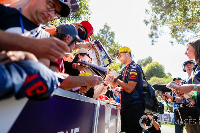 Daniel Ricciardo, Red Bull Racing, signs autographs for fans