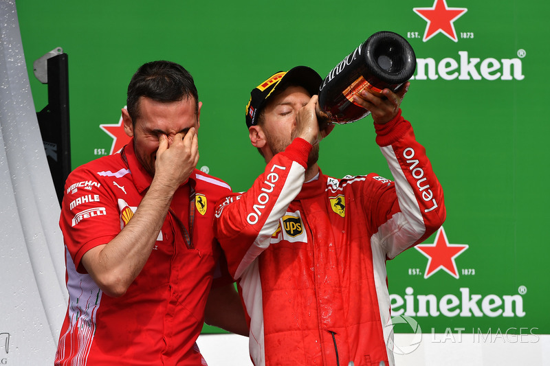 Sebastian Vettel, Ferrari celebrates on the podium with the champagne