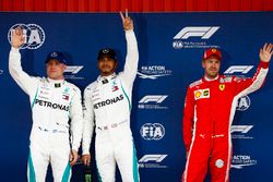 Lewis Hamilton, Mercedes AMG F1, celebrates pole position with Valtteri Bottas, Mercedes AMG F1, and Sebastian Vettel, Ferrari