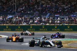 Lewis Hamilton, Mercedes AMG F1 W09, leads Fernando Alonso, McLaren MCL33, Pierre Gasly, Toro Rosso STR13, and Romain Grosjean, Haas F1 Team VF-18