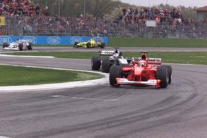 Rubens Barrichello, Ferrari F1 2000 leads David Coulthard, McLaren MP4/15 Mercedes