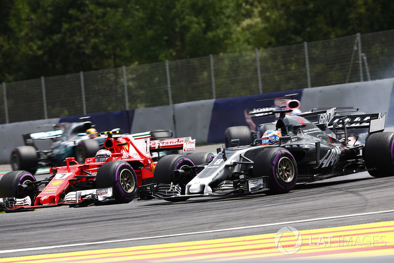 Kimi Raikkonen, Ferrari SF70H, battles Romain Grosjean, Haas F1 Team VF-17, ahead of Sergio Perez, S