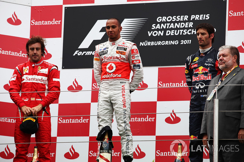 The podium: Fernando Alonso, Ferrari, Lewis Hamilton, McLaren and Mark Webber, Red Bull Racing