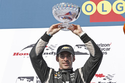 Second place Simon Pagenaud, Team Penske Chevrolet, celebrates on the podium