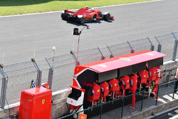 Sebastian Vettel, Ferrari SF71H passes Ferrari pit wall gantry