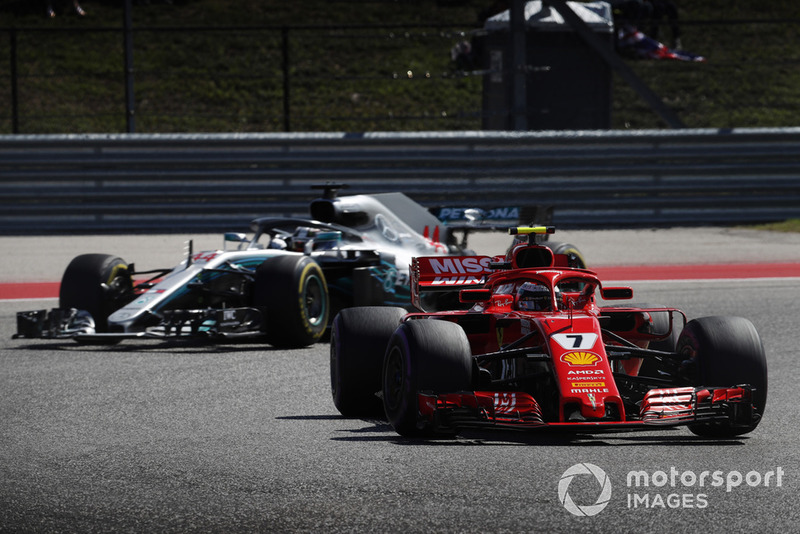 Kimi Raikkonen, Ferrari SF71H, leads Lewis Hamilton, Mercedes AMG F1 W09 EQ Power+