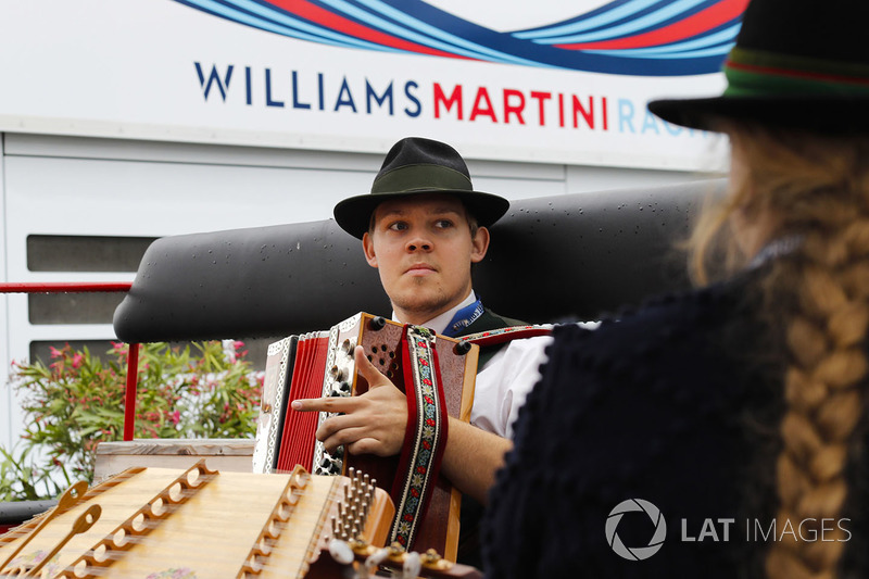 Musicians play in the paddock