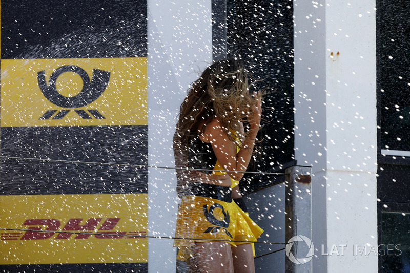 Podium: Grid girl get the champagne shower