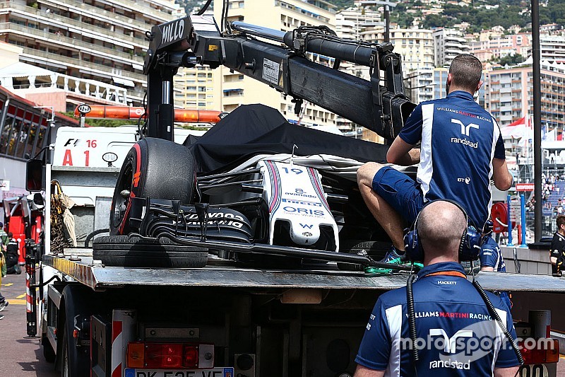 The Williams FW38 of Felipe Massa, Williams is recovered back to the pits on the back of a truck