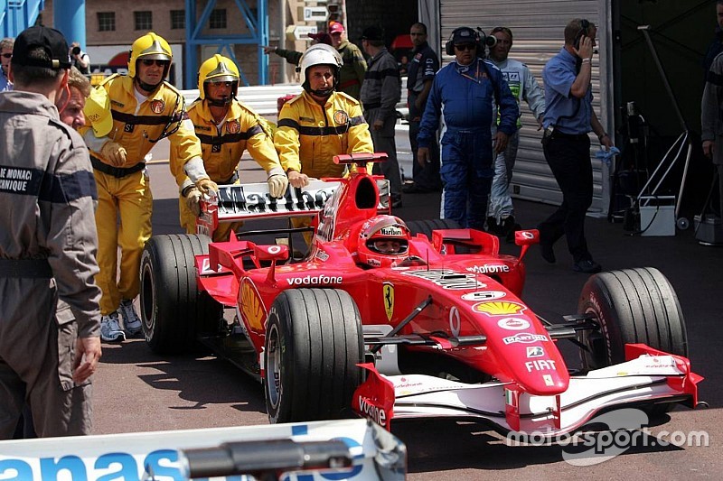 Michael Schumacher pushed to Parc Fermé