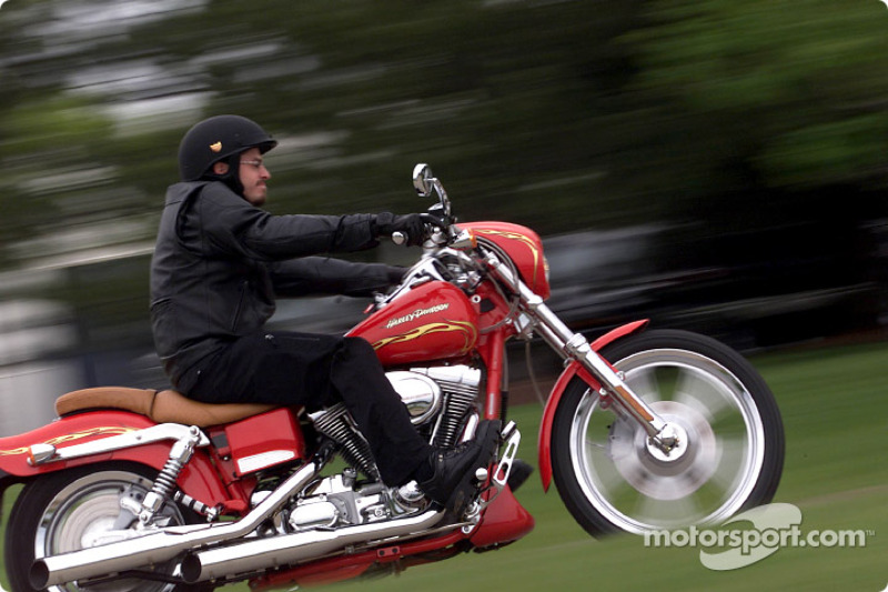 Patrick Carpentier rumbling through the streets of Milwaukee on a 2001 Deuce Harley-Davidson