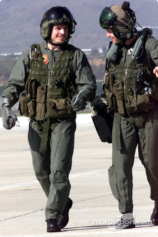 Patrick Carpentier chats with Captain Aaron Marx upon their return from a training mission aboard a AH-1W Cobra helicopter