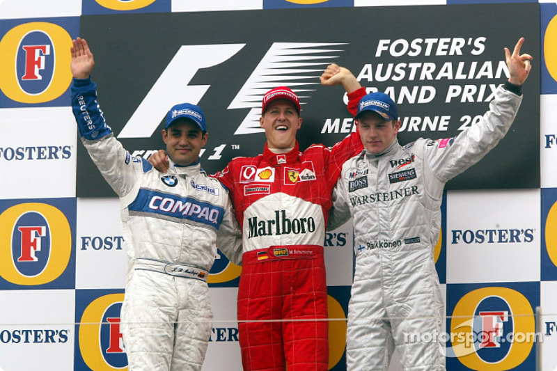 The podium: race winner Michael Schumacher, with Juan Pablo Montoya and Kimi Raikkonen