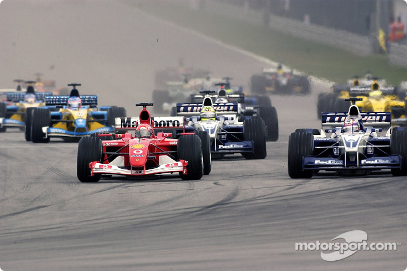 The start: Michael Schumacher battling with Juan Pablo Montoya