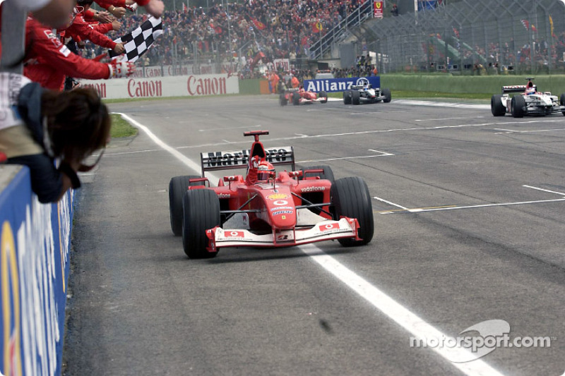 Michael Schumacher takes checkered flag