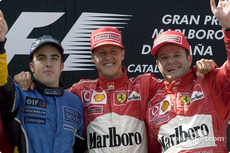 Podium: race winner Michael Schumacher met Fernando Alonso en Rubens Barrichello