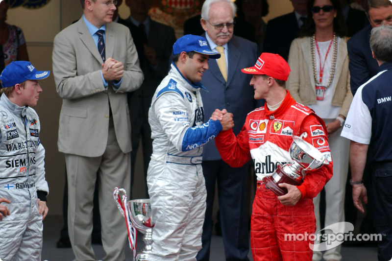 Podio:  ganador de la carrera Juan Pablo Montoya, Kimi Raikkonen y Michael Schumacher