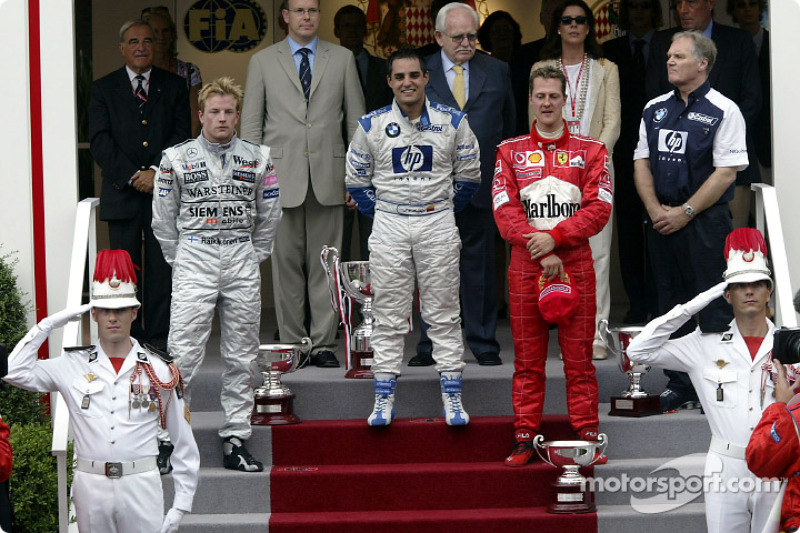 The podium: race winner Juan Pablo Montoya with Kimi Raikkonen and Michael Schumacher