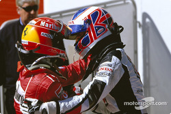 Race winner Michael Schumacher and Jenson Button congratulate each other