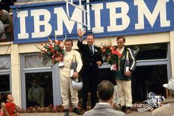 From left: Bruce McLaren, Henry Ford II and Chris Amon on the victory podium after the 1966 24 Hours of Le Mans