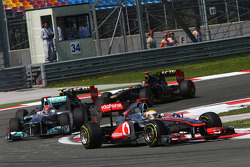 Lewis Hamilton, McLaren Mercedes leads Michael Schumacher, Mercedes GP F1 Team