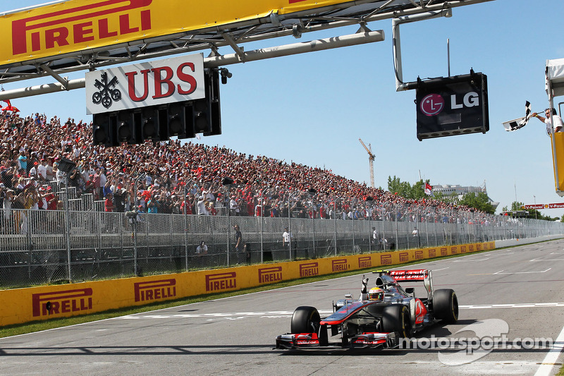 Race winner Lewis Hamilton, McLaren Mercedes takes the chequered flag at the end of the race