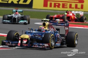 Mark Webber, Red Bull Racing leads Michael Schumacher, Mercedes AMG Petronas