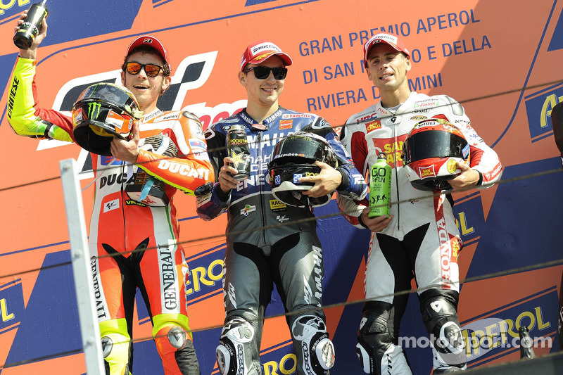 Podium: race winner Jorge Lorenzo, second place Valentino Rossi, third place Alvaro Bautista