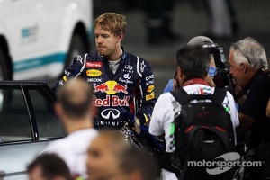 Sebastian Vettel, Red Bull Racing is escorted back to parc ferme