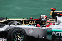 Michael Schumacher, Mercedes AMG F1 and Kimi Raikkonen, Lotus F1 battle for position