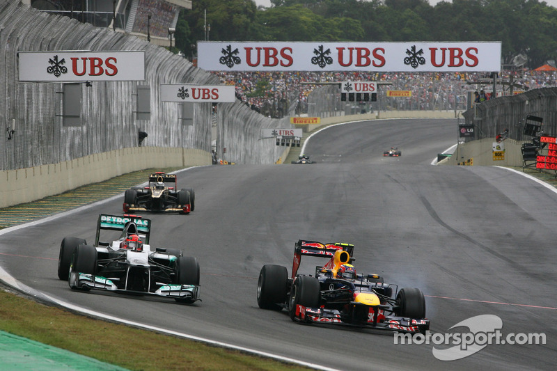 Michael Schumacher, Mercedes GP and Mark Webber, Red Bull Racing