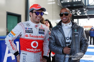 (L to R): Sergio Perez, McLaren with Lewis Hamilton, Mercedes AMG F1