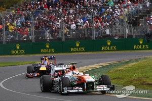 Adrian Sutil, Sahara Force India VJM06 leads Sebastian Vettel, Red Bull Racing RB9